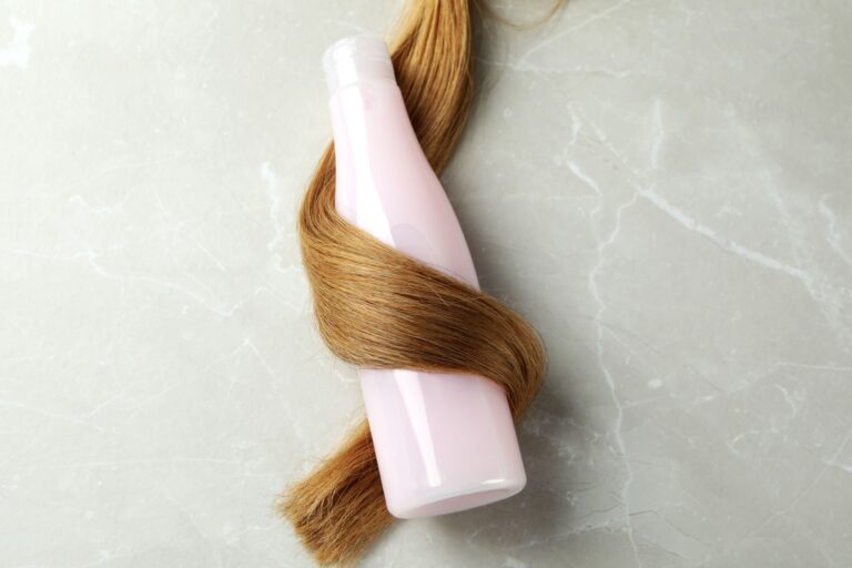 a-lock-of-female-hair-with-shampoo-bottle-2023-11-27-05-06-20-utc-1-1-768x512